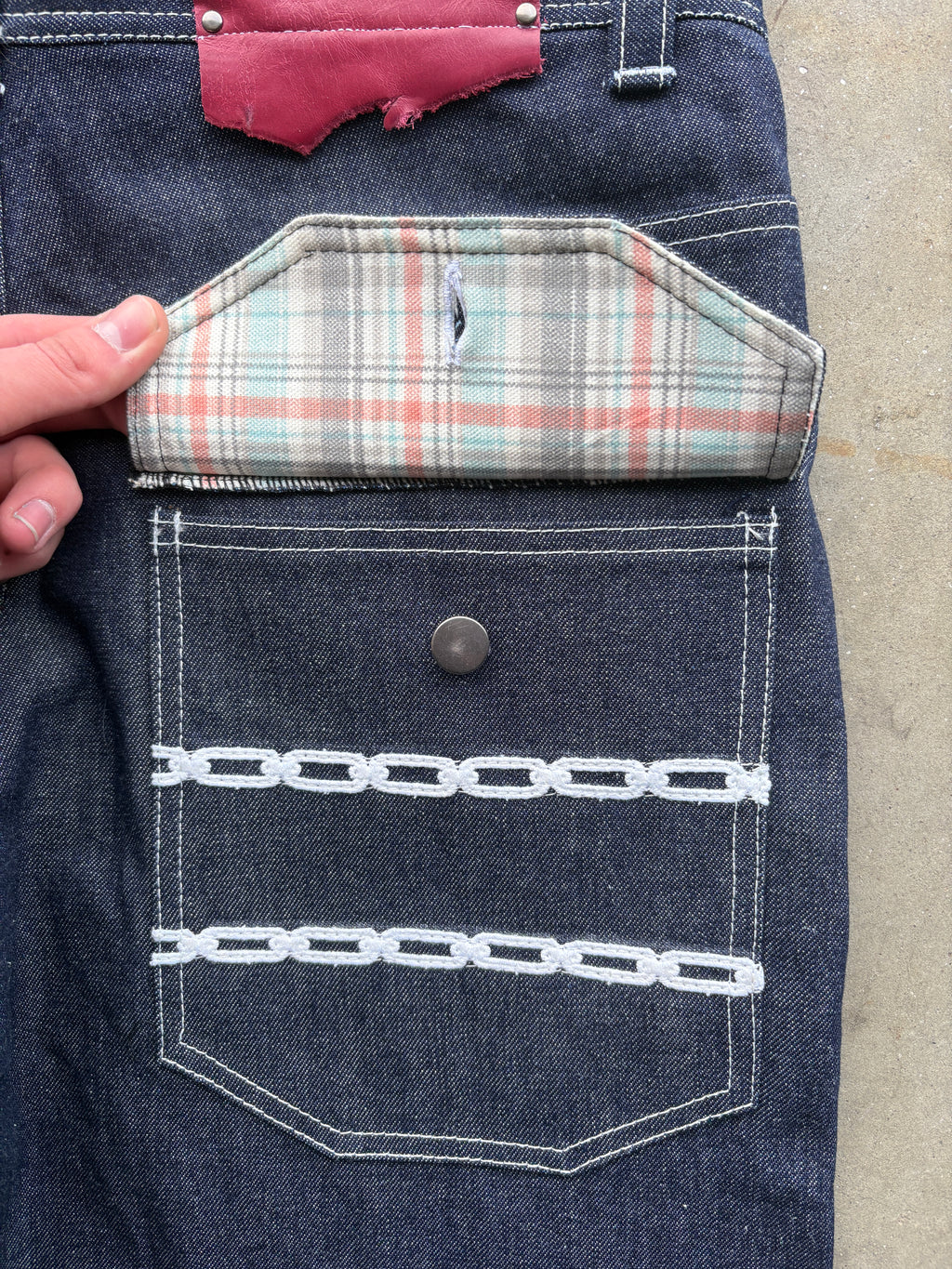 CHAIN LINK RAW DENIM JEANS