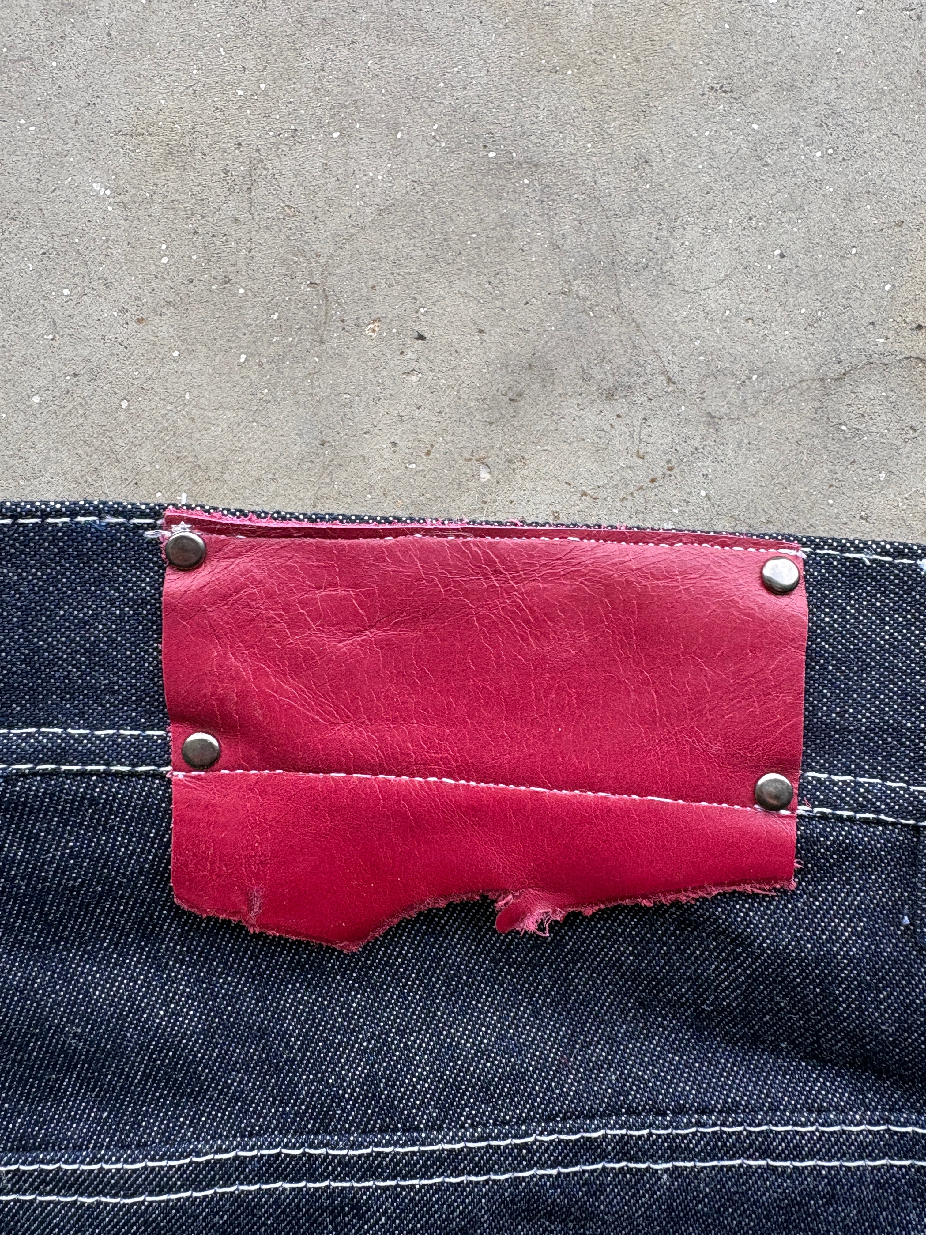 CHAIN LINK RAW DENIM JEANS